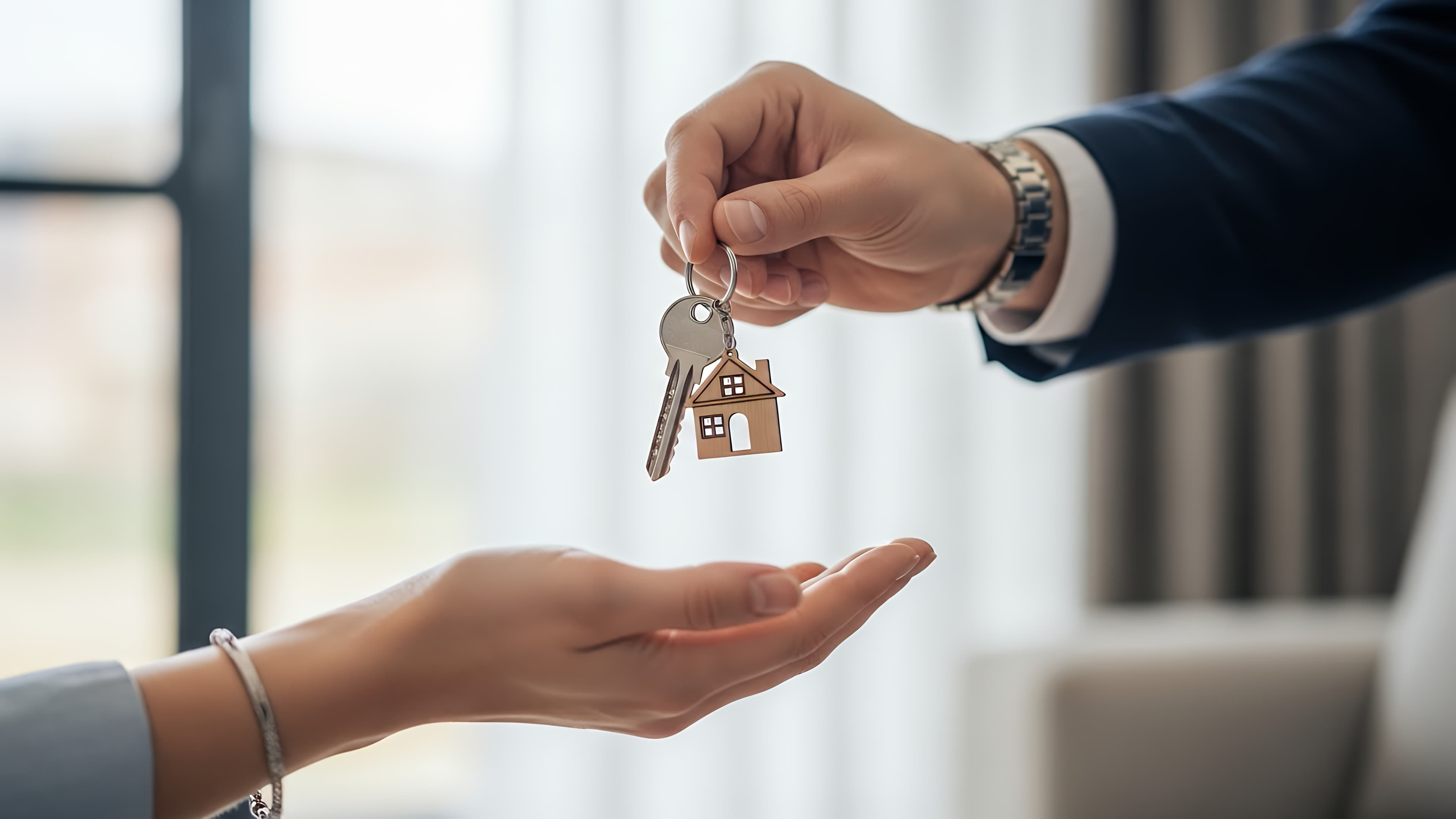 Property manager handing over keys at a luxury home