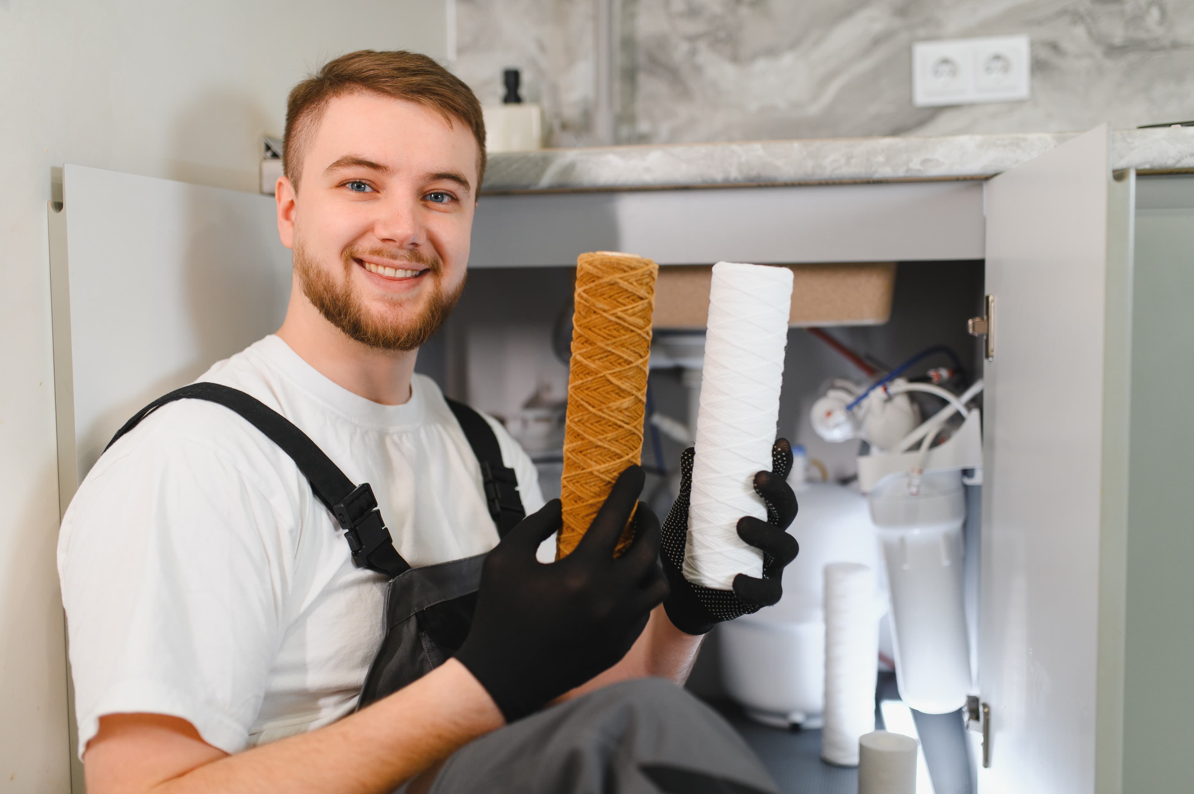 Reverse osmosis filter cartridge being replaced